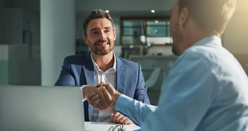 what does a fractional cfo do, shaking hands in office