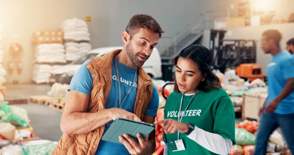 financial tips for nonprofits, nonprofit team looking at tablet