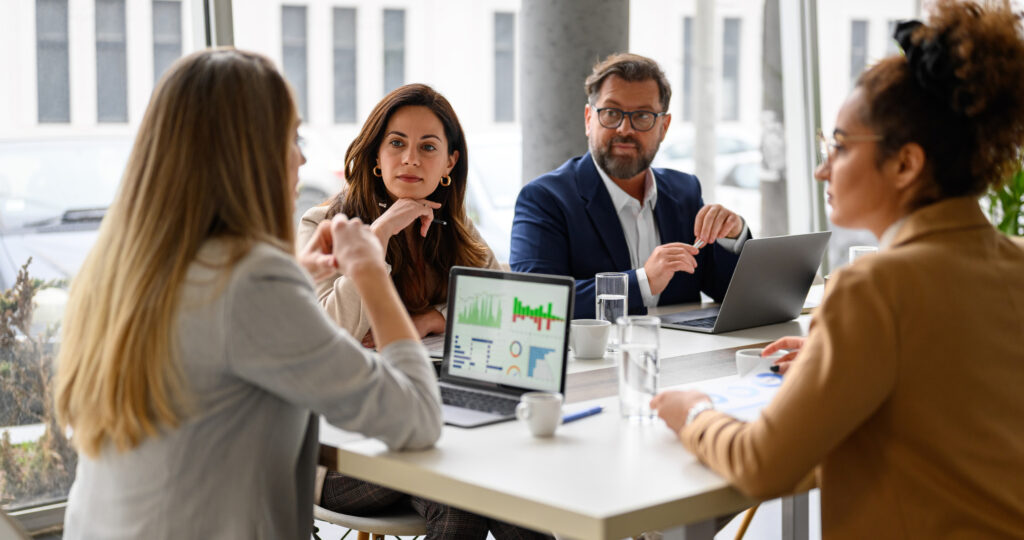how to outsource accounting services, accounting team meeting in office
