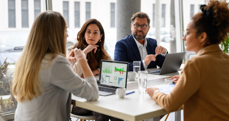 how to outsource accounting services, accounting team meeting in office